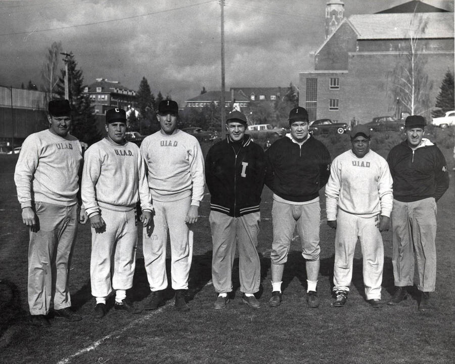 Football coaches identified from left to right: R. B. Johnson, Gary Kenworth, Wayne Walker, Skip Stahley, Don Swartz, Ken Hall, Ed Knecht of the University of Idaho.