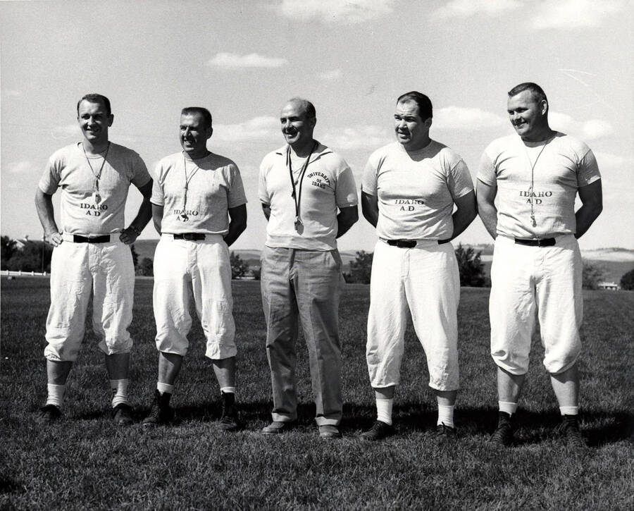 Football coaches identified from left to right: Wayne Anderson, Ed Knecht, Head coach Skip Stahley, Don Swartz, R.V. Johnson of the University of Idaho.