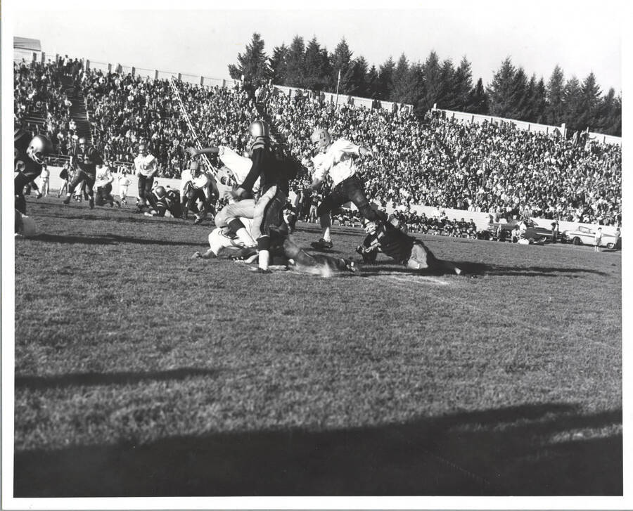Two Idaho defenders converge on a San Jose State runner.