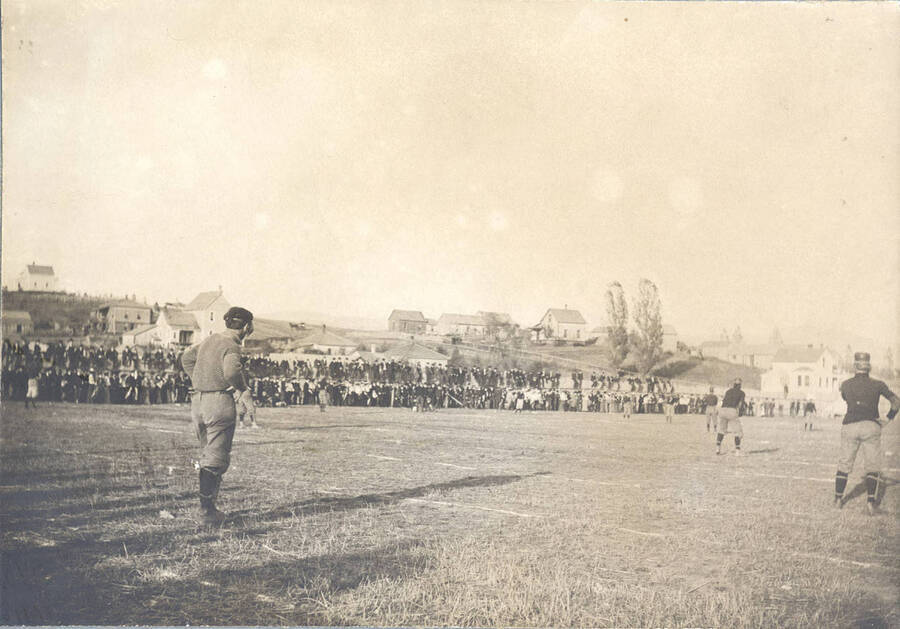 An unidentified player stands back, preparing to receive a kickoff.