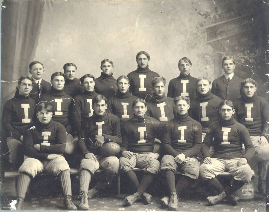 Coach John G. 'Pink' Griffith, Adamson, Campbell, Kerns, Keyes, Galloway; Center) Thomas, Rogers, Fogle, Snow, Sheridan, Larson Magee; Front) Russel, Miller, Middleton, C. Smith, Sprague are pictured in this team photo, taken in the old Administration Building.