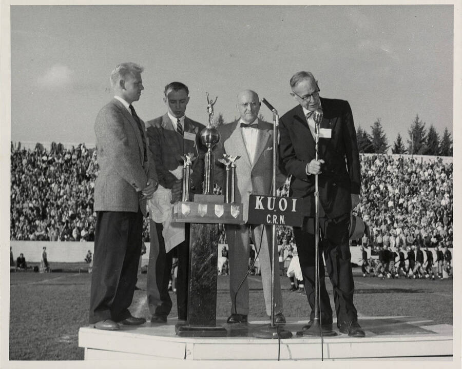 Clarence S. 'Hec' Edmundson addressing the Idaho and Washington State College football crowd after being presented a trophy for 'most inspirational player' by the Kappa Sigma fraternity.