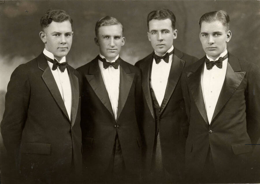 Portrait of the men in the quartet. Identification from left to right: Forest Brigham, Oral Luke, William Shamberger, Norman Luvass.