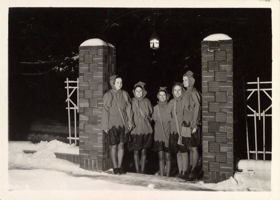 Picture of the Vandalettes standing outside in the snow. Individuals from Left to right: Elizabeth Thompson, Laura Bingham, Edna Scott, Harriet Baken, Bernice Smith.