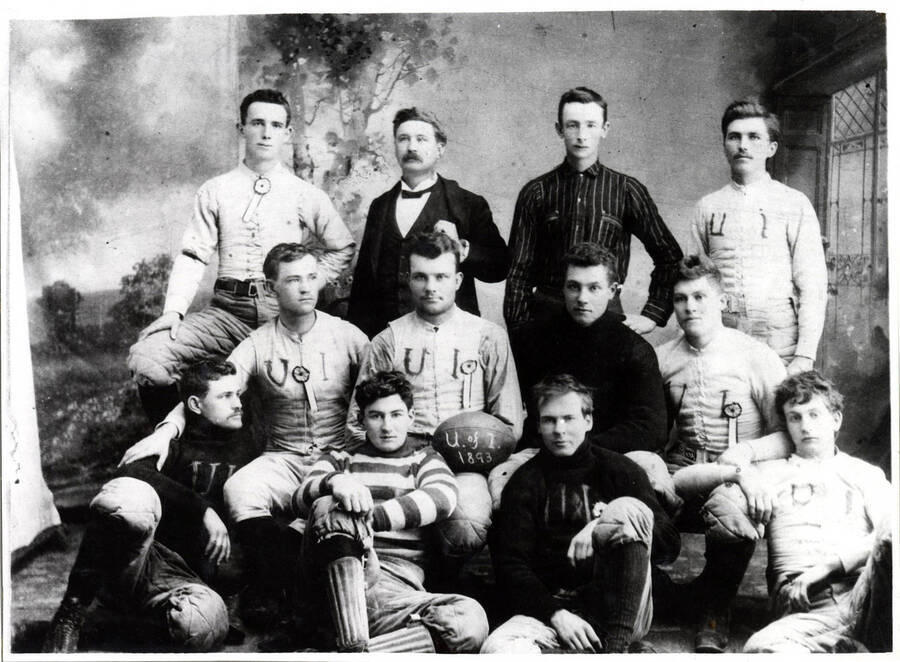 Portrait of the football team. Identification: 1st row) Charley Thomas, unidentified individual, Guy Edwards, Pete Craig. 2nd) Charley M. Barbee, unidentified individual, George Nifong, Walter Richardson. 3rd) A. Perl Baily, Dr. C.W. McCurdy, Art Simon, Charles Kirtley