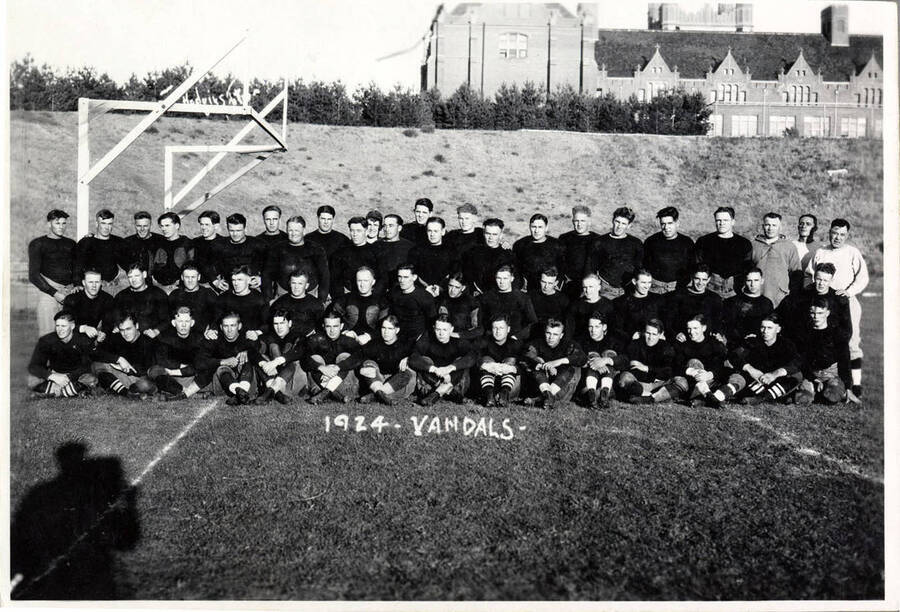Photograph of the University of Idaho varsity football team on the turf. Caption reads '1924 - Vandals.'