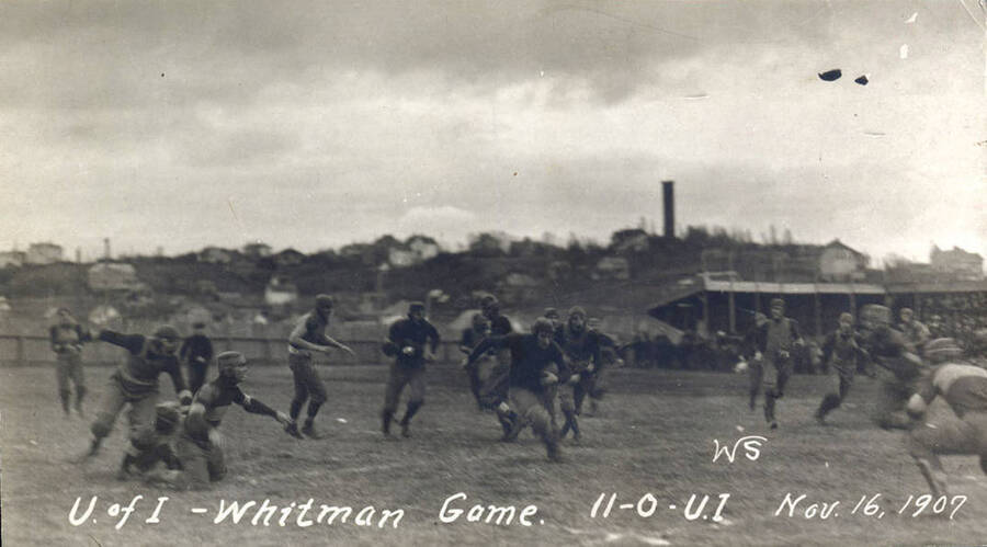 Photograph of the University of Idaho versus Whitman football game. Caption reads 'U of I-Whitman Game, 11-0-U.I,  Nov. 16, 1907.'