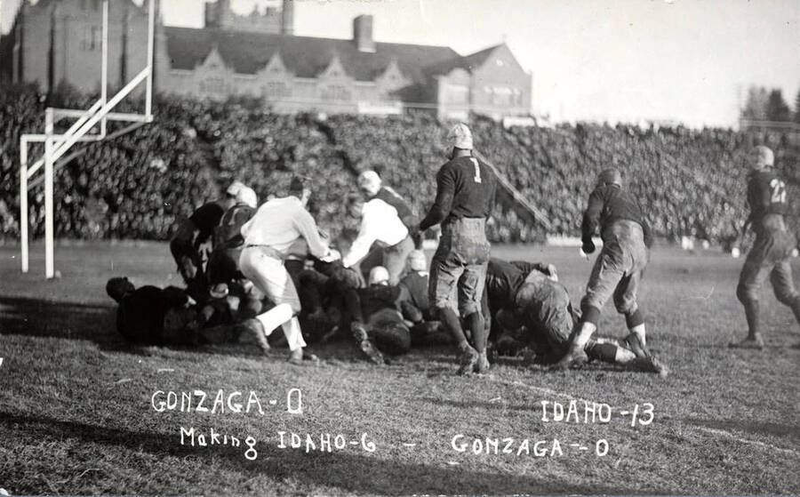 Photograph of the University of Idaho versus Gonzaga football game. Caption reads 'Gonzaga-0, Idaho-13, Making Idaho-6, Gonzaga-0.'