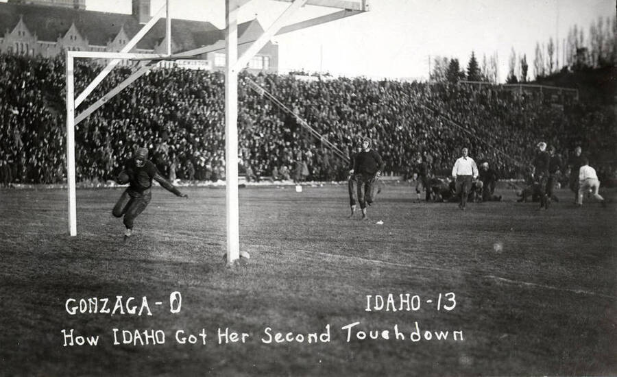 Photograph of the University of Idaho versus Gonzaga football game. Caption reads 'Gonzaga-0, Idaho-13, How Idaho Got Her Second Touchdown.'