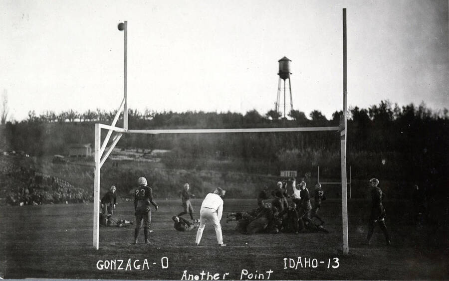 Photograph of the University of Idaho versus Gonzaga football game. Caption reads 'Gonzaga-0, Idaho-13, Another Point.'