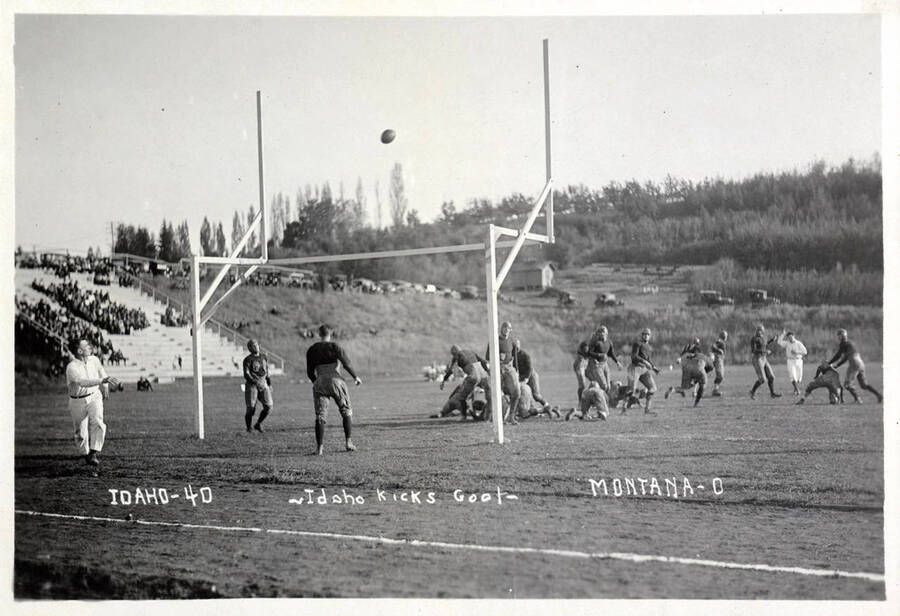 Photograph of the University of Idaho versus Montana football game. Caption reads 'Idaho-40 ~Idaho Kicks Goal~ Montana-0.'