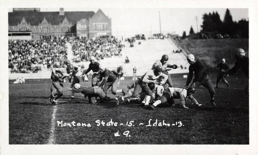 Photograph of the University of Idaho versus Montana State football game. Caption reads 'Montana State-15, Idaho-13, 9.'