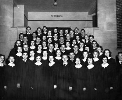 A group portrait of the Vandaleers standing on the staircase at the entrance of Memorial Gymnasium.