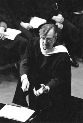 A candid photograph of Glen Lockery in the midst of directing the Vandaleers.