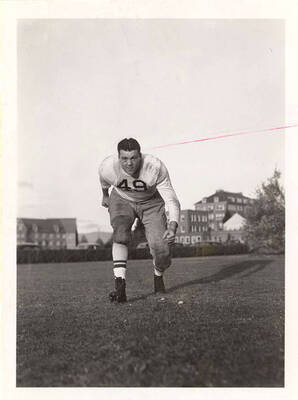 Tackle for the University of Idaho football team, Irvin Konopka, running on the field.