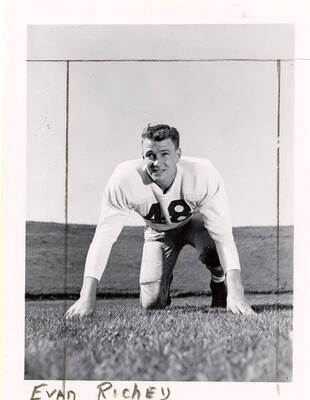 Evan Richey (#48), a tackle on the University of Idaho football team, crouching on the football field.