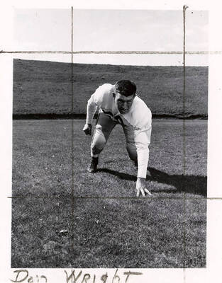Don Wright, a guard for the University of Idaho football team, crouching on the football field.