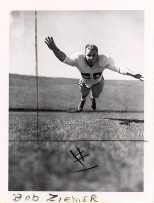 Action shot of Bob Ziemer, a tackle for the University of Idaho football team.