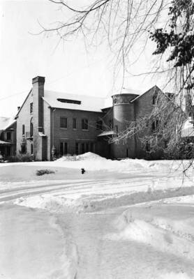 Kappa Alpha Theta house, on the southwest corner of University and Deakin Avenues, surrounded by snow.