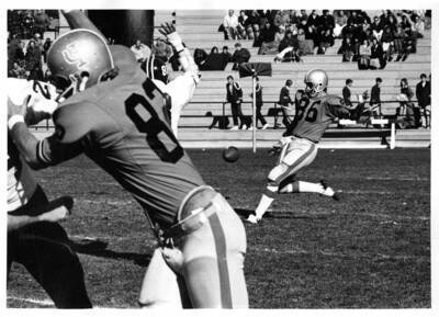 The opposing team goes to kick the ball during a University of Idaho football game.