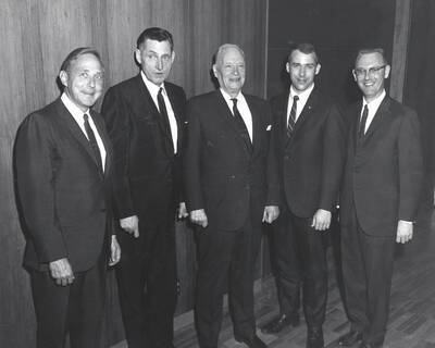 The first annual ceremony of Alpha Kappa Psi honors Henry L. Day, a mining executive of Wallace, as 'Idaho Businessman of the Year'.