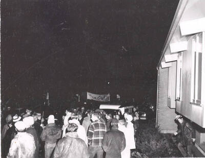 Students and faculty gathered outside of University of Idaho President Ernest Hartung's residence to show support for his policies and involvement in the campus.