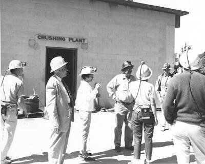 Group of Junior High and Senior High school teachers gather in front of the crushing plant  as part of a tour at Lucky Friday Mine at Mullan.