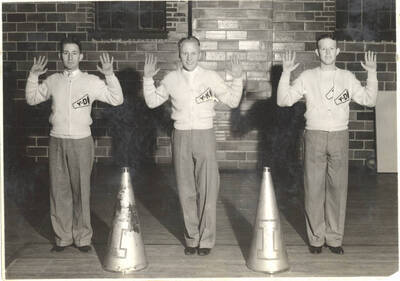 Yell king Paul Kerr and his dukes Donald McKee and Otto Power pose for a photo with their hands raised.