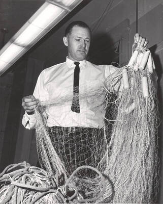 Dr. Craig McPhee prepares to work on research aimed at ridding scrap fish without endangering worthwhile species.