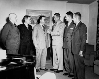 Tine W. Davis is initiated into Sigma Chi 17 years late because of the death of his father.