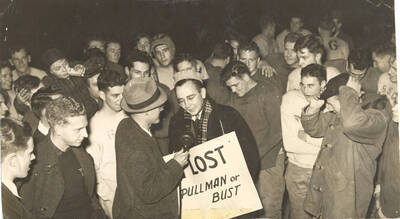 Argonaut sports editor Bill McGowan answers questions about his proposal of the 'Loser's Walk'. Babe Hollenberry, head coach at WSC, and Lloyd Salt, editor of the WSC Evergreen, stand to his left and right respectively.