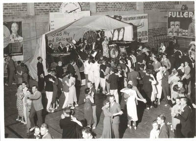 A live jazz band performs at the Publications Ball while students dance in the Memorial Gymnasium.