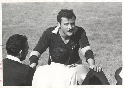 University of Idaho soccer team captain speaks to his other team members during a break in the game.