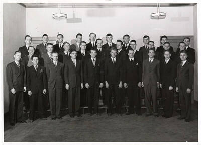 Group photo of the University Singers men's chorus before a performance.