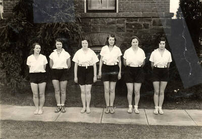 Women's Recreation Association championship volleyball team poses for a photo outside of the Women's Gymnasium.