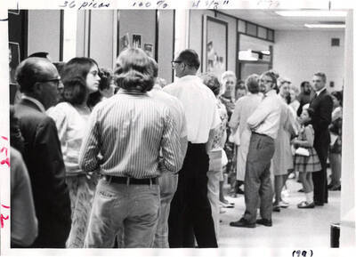 People of varying ages wait in line outside the KIVA before a Summer Theatre performance.