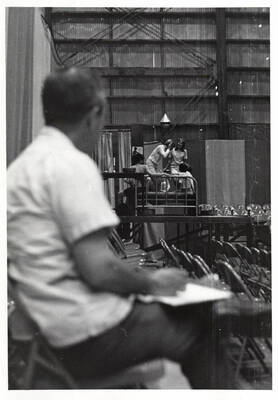 Director Ed Chavez watches six theater students as they rehearse in the Field House for Summer Theatre.