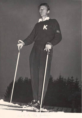 Skier Sverre Kongsgaard stands at the top of a slope looking into the distance. The caption on the bottom of the photograph reads 'look to the future.'