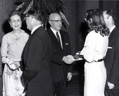 President Donald R. Theophilus and Cora Theophilus greet guests at the faculty reception.