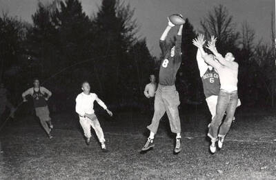A pass is snagged during the Fiji vs. Delta Chi intramural semi-final touch football game.