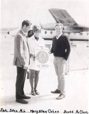 Idaho Senator John Mix, Mary Ellen Cohee, and Scott McClure hold a sign for 'All Idaho Week.'