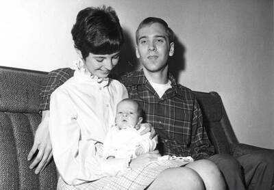 Roger Teichgraeber, graduate student at University of Idaho, sits next to his wife Sue and their child.  Teichgraeber Benefit Fund was established for babies who have a misformed esophagus.