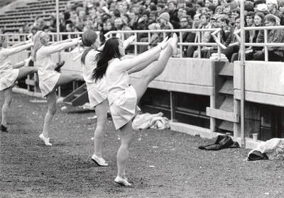 The Pom-Pom Girls lead the crowd in a cheer on the sidelines of MacLean field.