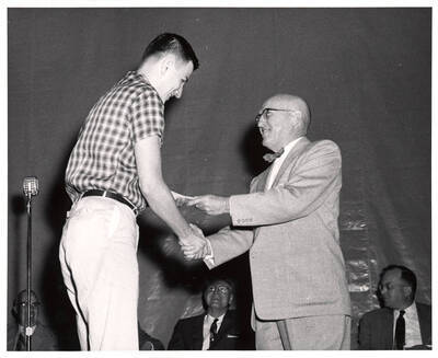 University of Idaho student Arthur D. Roberts receives the Idaho School Trustees Association award from President Donald R. Theophilus.