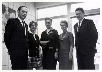 University of Idaho student Marla Thomas is awarded the annual $200 scholarship award check by the Idaho State Federation of Garden Clubs. Individuals identified from left to right: Professor J.W. Guthrie, Miss Thomas, Mrs. Orma Stubbs, Mrs. Richard Benscotter and Robert McConnell