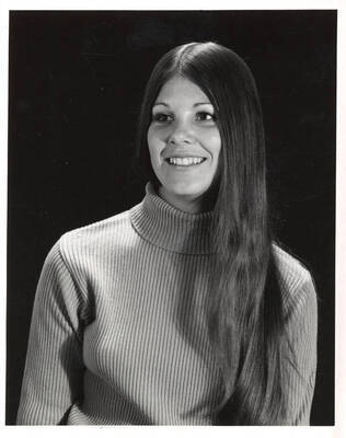 Ms. Trounson smiles during her formal portrait.