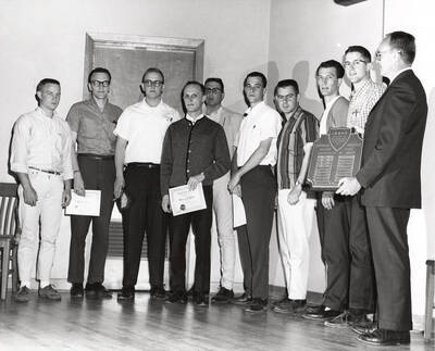 Members of the Idaho Society of Professional Engineers recognize the recipient of the Outstanding Graduating Engineer Award.