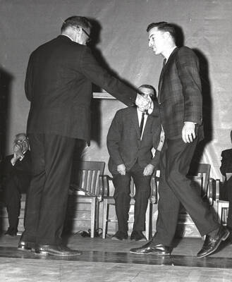 President Ernest W. Hartung congratulates University of Idaho student Charles Lee Davis upon receiving two certificates of merit in the College of Law.