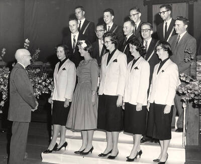 Outstanding seniors receive special awards from President Donald Theophilus. Individuals identified as listed. Front: Ann Marie Becker, Edith Louise Vandenbark, Neela McCowan, Patricia Kay Bozarth, Carolyn Dempsey Mitchell; middle: Dwight Chapin, Leo Tafolla, Karl Bittenbender, Jack Macki, James Flanigan; back: Bruce Summers, Terence White, William Agee, etc.