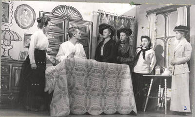 From l-r: Marjorie Dean as Mama, Otis Walter as Uncle Chris, Margaret Payne as Aunt Jenny, Nancy Smith as Aunt Sigrid, Darlene Henderson as Katrin and Lillian Bowler as Aunt Trina. The conversation between the family acted out in Idaho drama's production of 'I Remember Mama.' An ASUI production directed by Jean Collette in the University Auditorium.